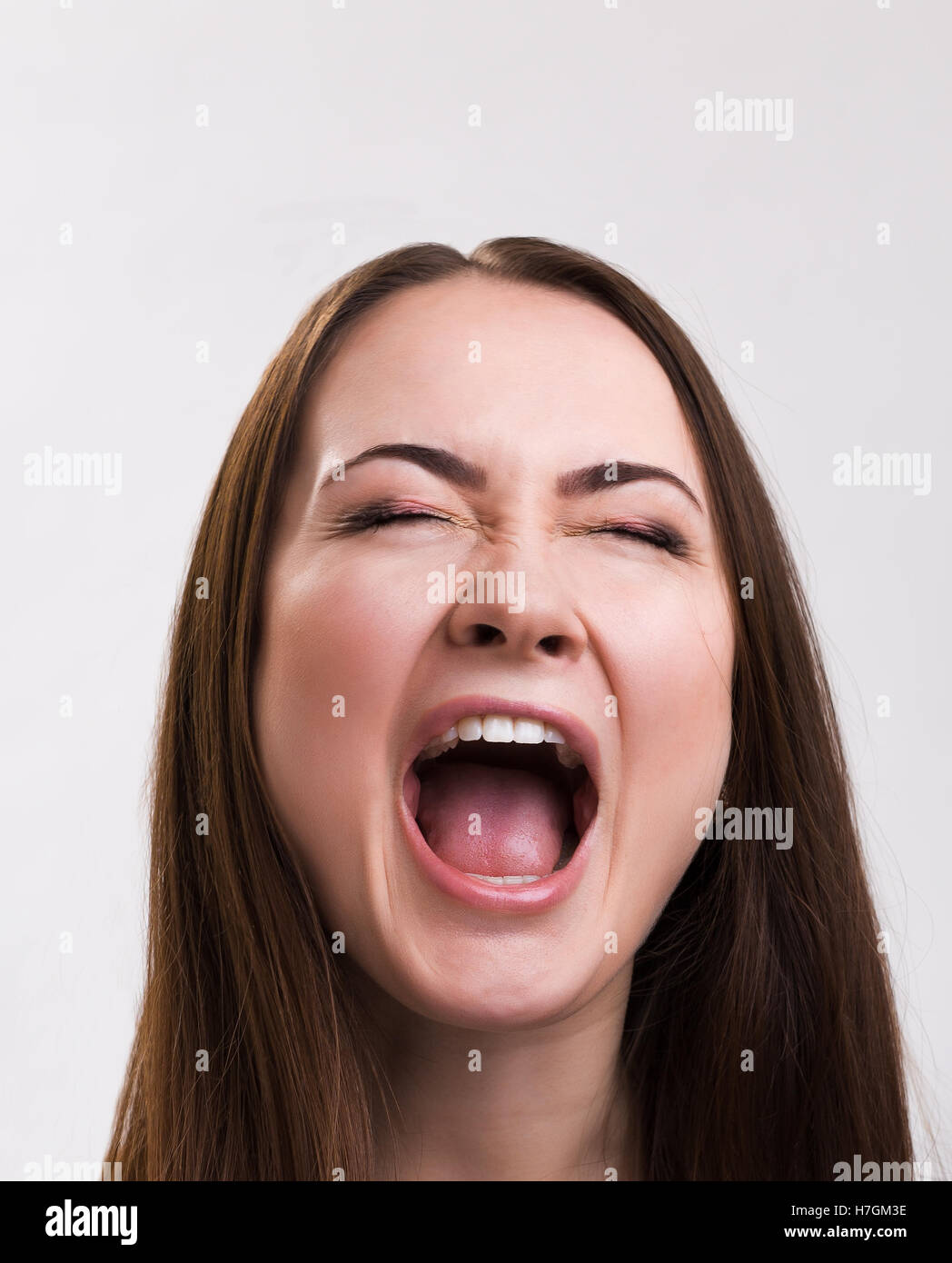 Emotion series of young and beautiful ukrainian girl - loud screaming Stock Photo