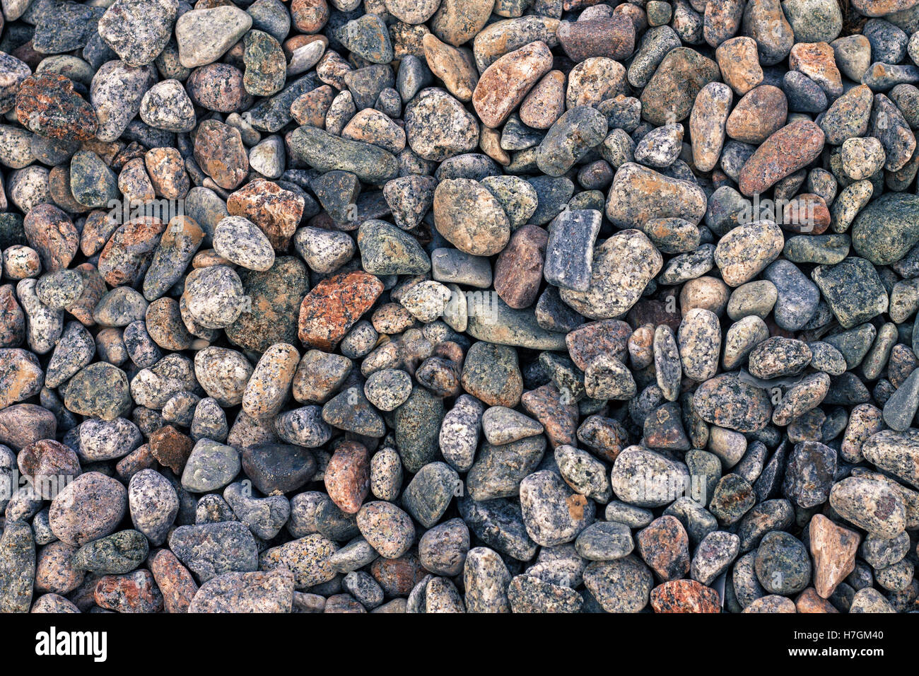 Abstract background with decorative floor pattern of sea gravel stones, Gravel texture Stock Photo