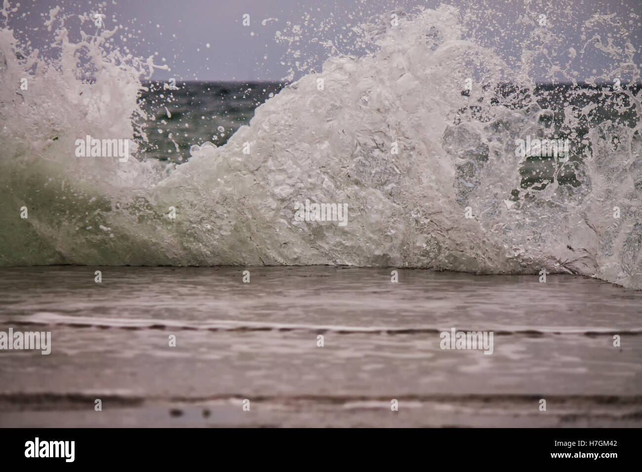 Powerful sea splash wave with sprays and foam Stock Photo