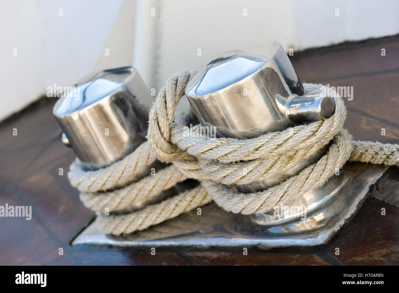 Stainless steel pillar with rope on boat Stock Photo