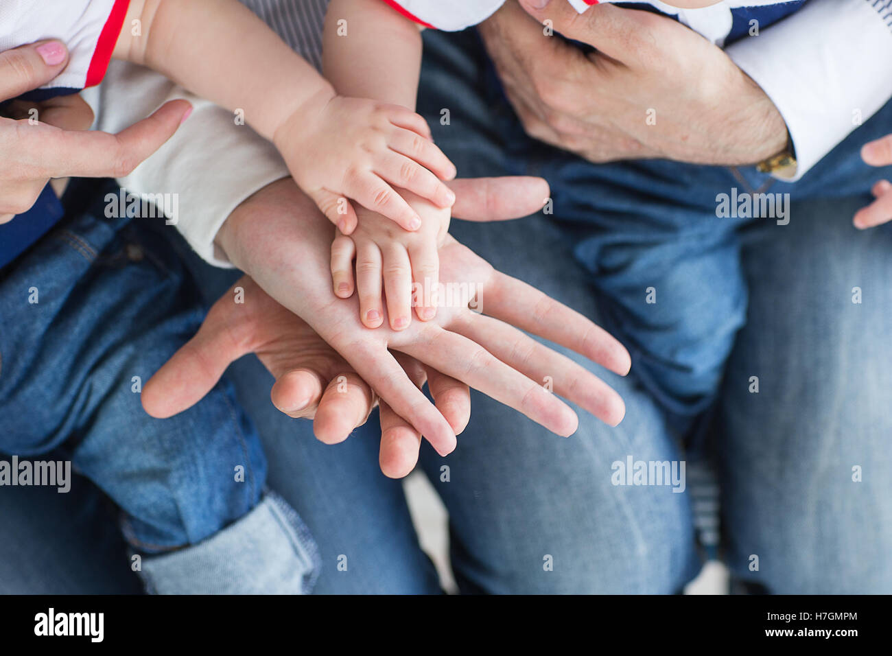 Family holding hands together closeup. Happy family Stock Photo - Alamy