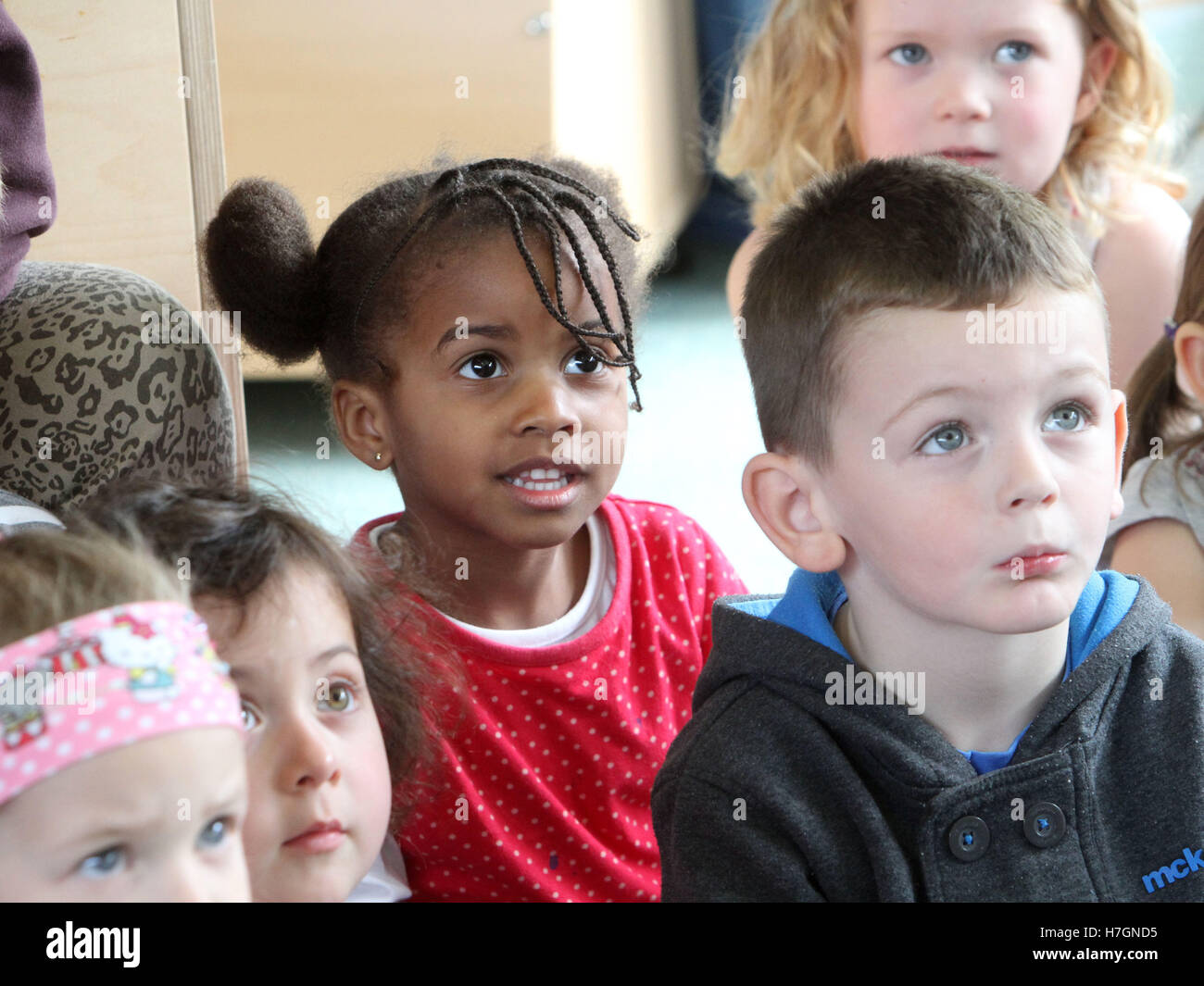 Nursery children looking engaged and interested Stock Photo