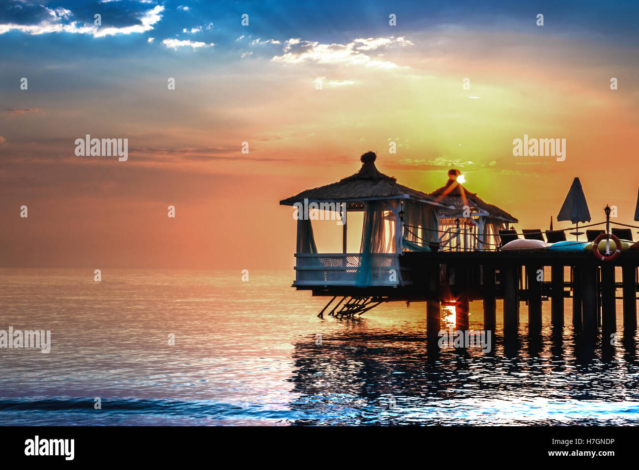 Sunrise over water bungalows Stock Photo