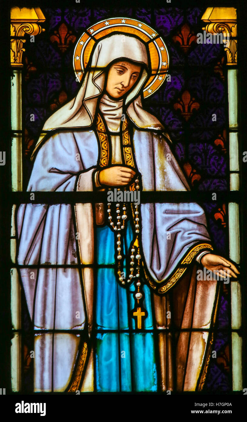 Stained Glass window depicting the Blessed Virgin Mary, in the Cathedral of Saint Rumbold in Mechelen, Belgium. Stock Photo