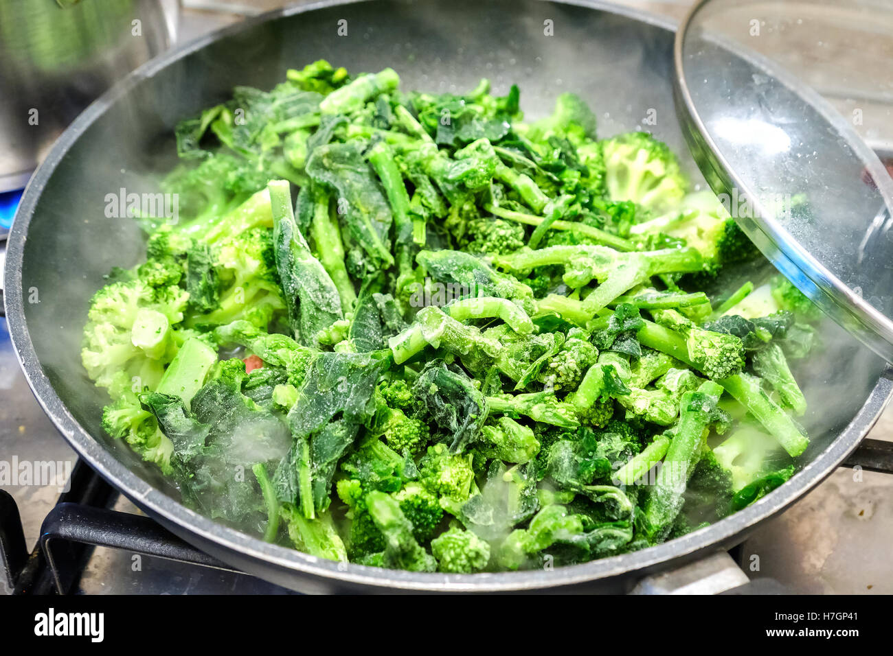 frozen broccoli turnip green cooking vegetable pan Stock Photo