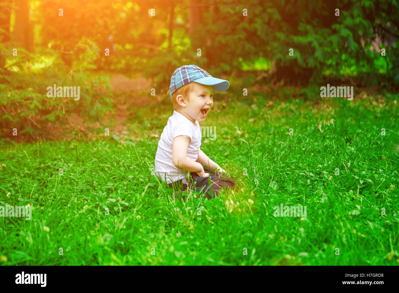 Portrait of a happy little boy in the park Stock Photo - Alamy
