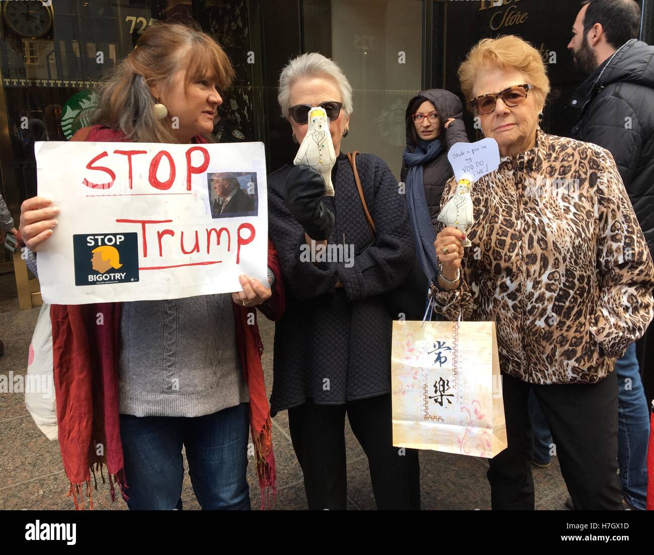 New York, NY, USA. 4th Nov, 2016. Anti-Trump protestor and women holding Donald Trump voodoo dolls protest outside of Trump Tower in New York, New York on November 2, 2016. © Rainmaker Photo/Media Punch/Alamy Live News Stock Photo