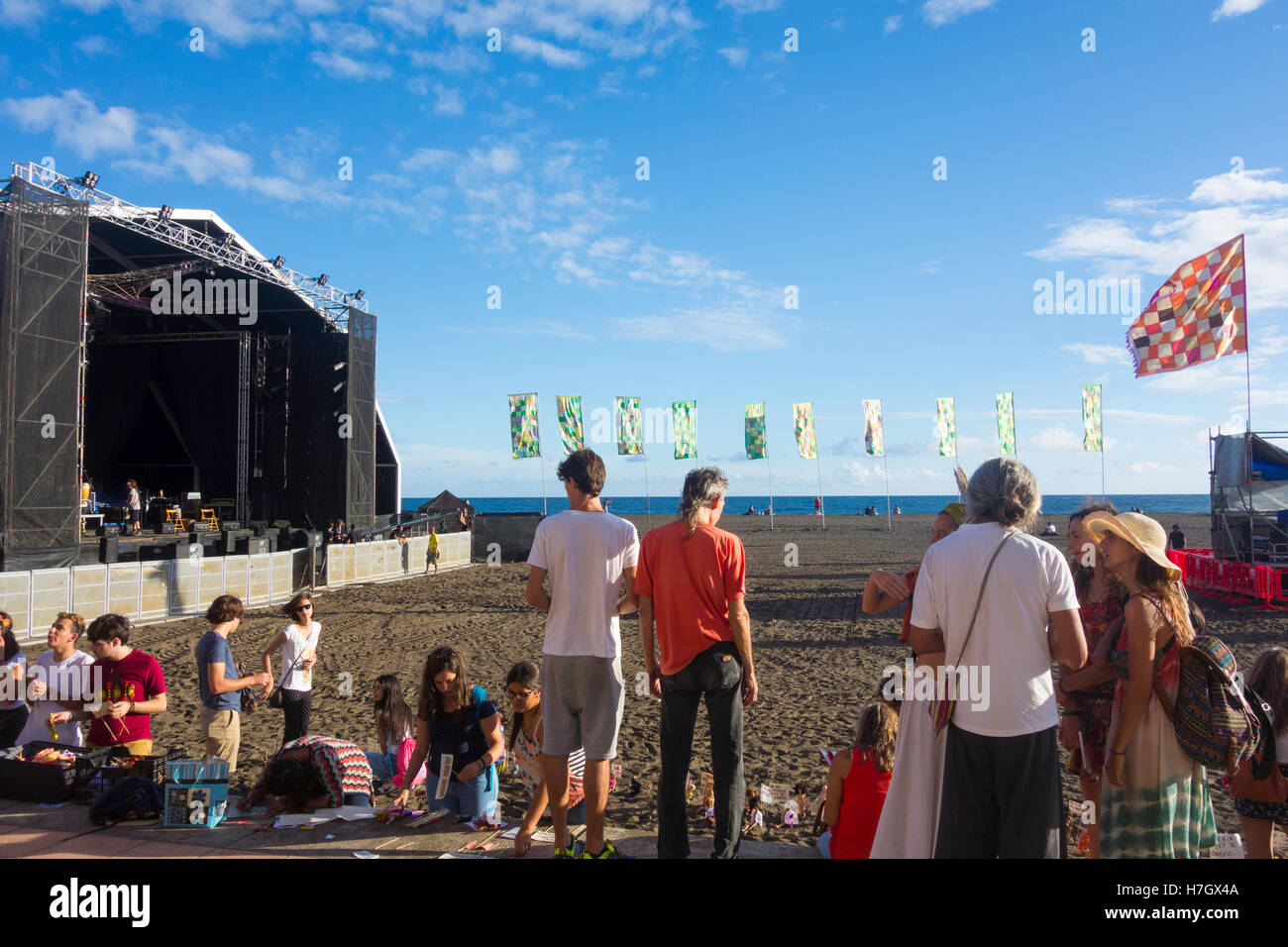 Gran Tarajal, Fuerteventura, Canary Islands, Spain. 4th November, 2016. Womad flags flying on the beach between stages in late afternoon sunshine on the first day (4th-6th Nov) of the Womad music festival on the beach at Gran Tarajal on Fuerteventura. Credit:  Alan Dawson News/Alamy Live News Stock Photo