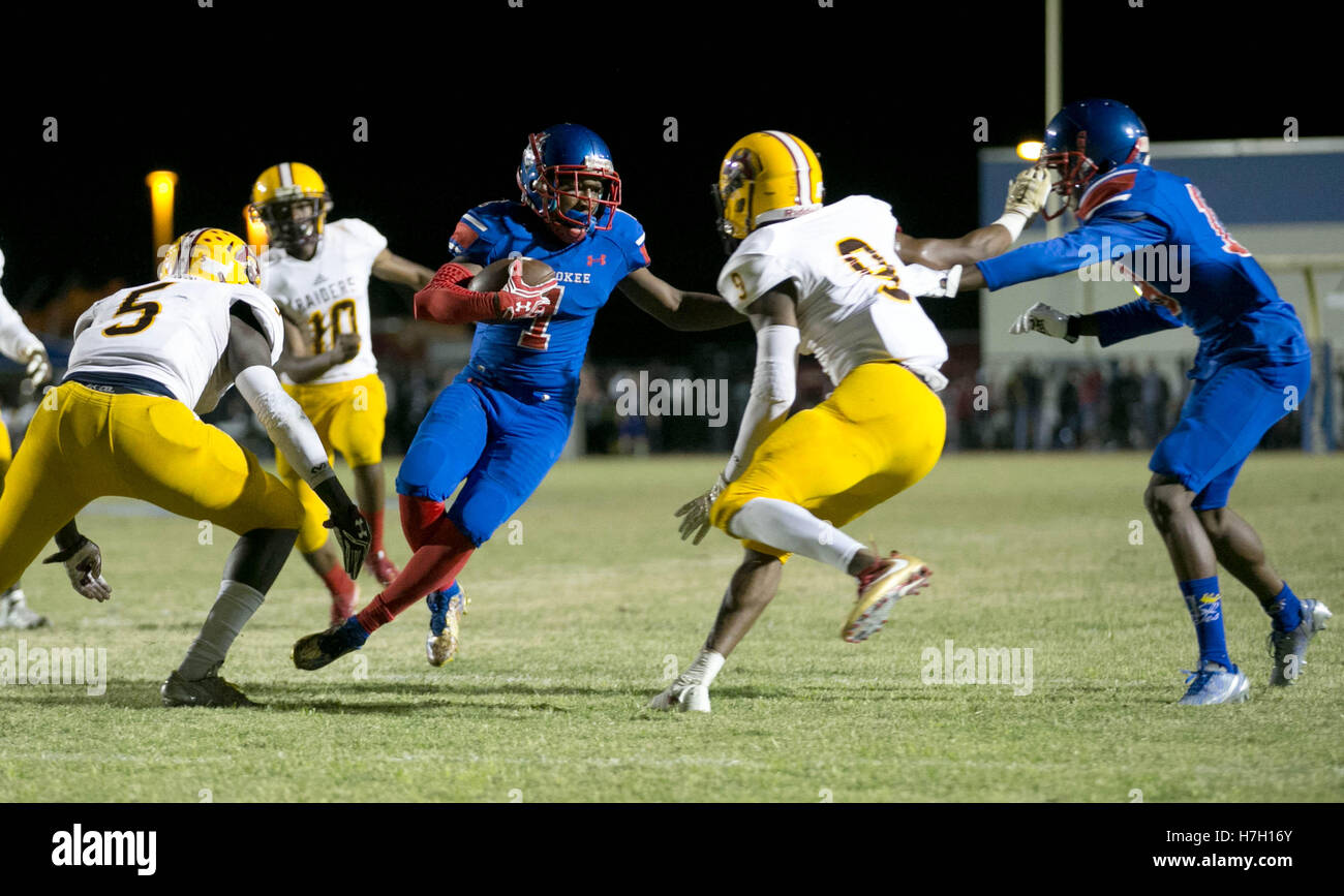 Pahokee, Florida, USA. 4th Nov, 2016. Pahokee Blue Devils Rodney McKay (1) cuts outside to get past Glades Central Raiders Siurpry Rinvil (5) and Glades Central Raiders Jamarian Green (9) to score a touchdown in the first quarter in Pahokee, Florida on November 4, 2016. © Allen Eyestone/The Palm Beach Post/ZUMA Wire/Alamy Live News Stock Photo