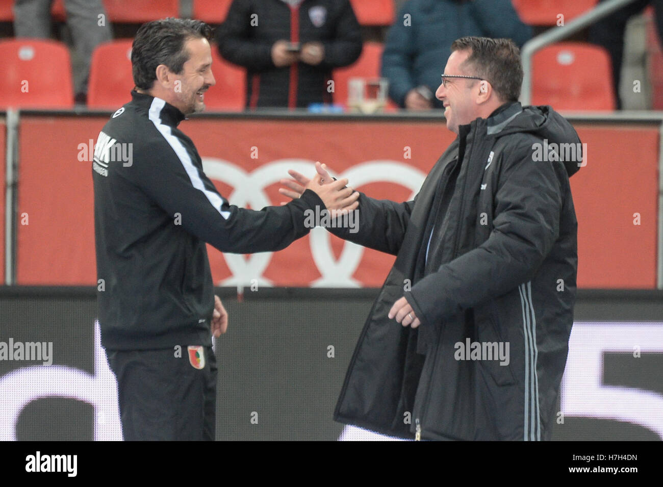 Ingolstadt, Germany. 5th Nov, 2016. Coach Markus Kauczinski (r) of Ingolstadt and coach Dirk Schuster of Augsburg greet each other before the soccer match between FC Ingolstadt o4 and FC Augsburg on the tenth match day of the Bundesliga at Audi Sportpark in Ingolstadt, Germany, 5 November 2016. PHOTO: ARMIN WEIGEL/dpa (ATTENTION: Due to the accreditation guidelines, the DFL only permits the publication and utilisation of up to 15 pictures per match on the internet and in online media during the match.) Credit:  dpa/Alamy Live News Stock Photo