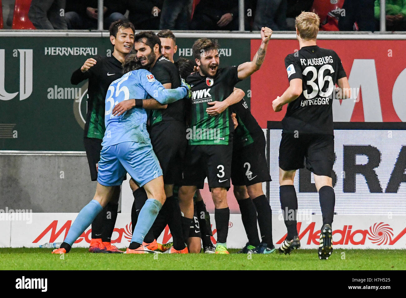 Ingolstadt, Germany. 5th Nov, 2016. Augsburg's players celebrate the score 0:2 against Ingolstadt during the soccer match between FC Ingolstadt o4 and FC Augsburg on the tenth match day of the Bundesliga at Audi Sportpark in Ingolstadt, Germany, 5 November 2016. PHOTO: ARMIN WEIGEL/dpa (ATTENTION: Due to the accreditation guidelines, the DFL only permits the publication and utilisation of up to 15 pictures per match on the internet and in online media during the match.) Credit:  dpa/Alamy Live News Stock Photo
