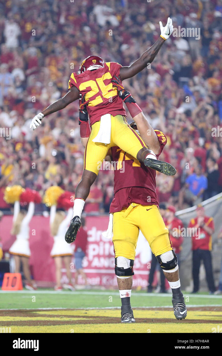 Los Angeles, CA, US, USA. 5th Nov, 2016. November 5, 2016: USC Trojans center Nico Falah (74) lifts USC Trojans running back James Toland IV (26) in celebration after a touchdown in the game between the Oregon Ducks and the USC Trojans, The Coliseum in Los Angeles, CA. Peter Joneleit/ Zuma Wire © Peter Joneleit/ZUMA Wire/Alamy Live News Stock Photo