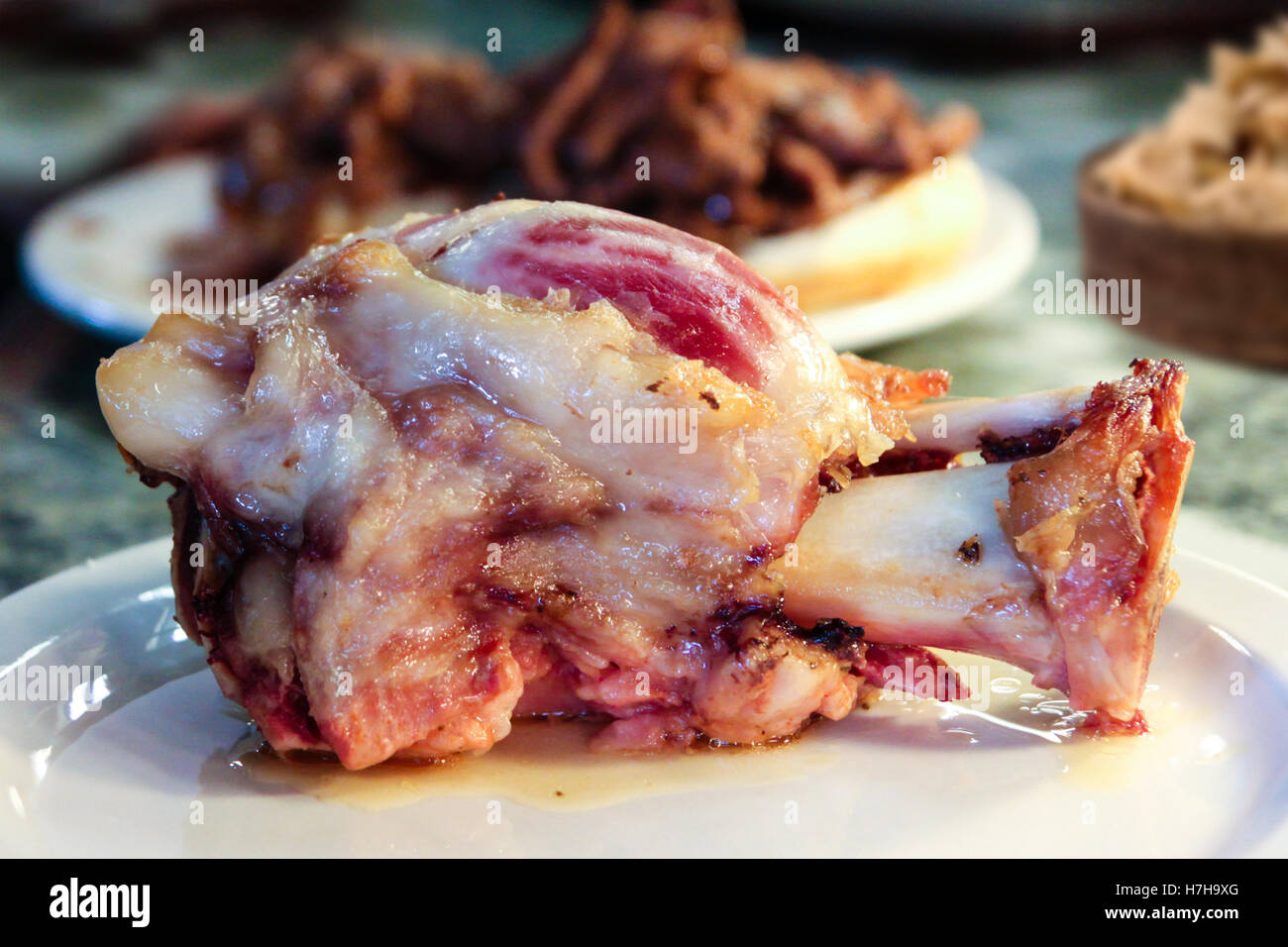 Traditional German ham hock dish with shallow depth of field on background. Stock Photo