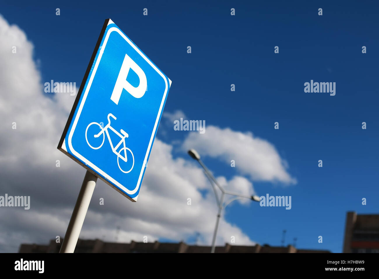 Bicycle parking sign on a background of the sky Stock Photo - Alamy