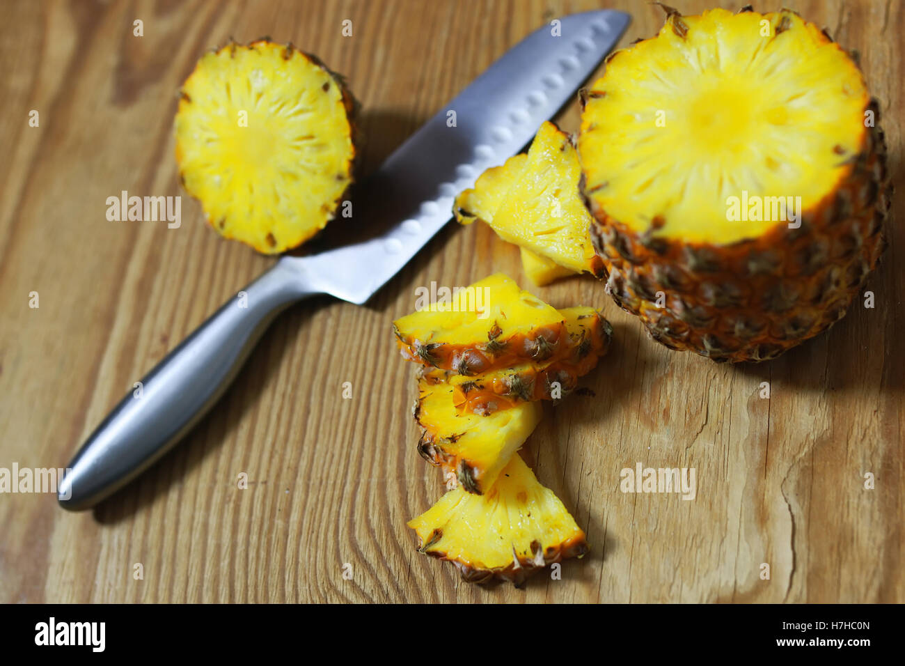 pineapple slices cut knife Stock Photo Alamy