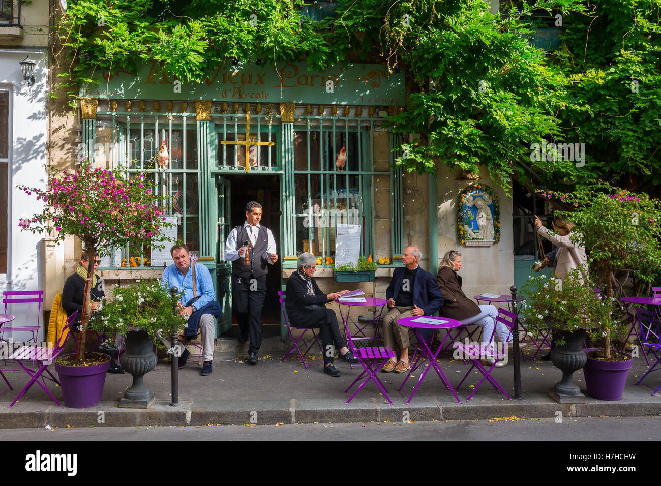 Paris, France - October 16, 2016: Cafe on the Ile de Cite with unidentified people. Ile de Cite is a Seine Island, it is the cen Stock Photo