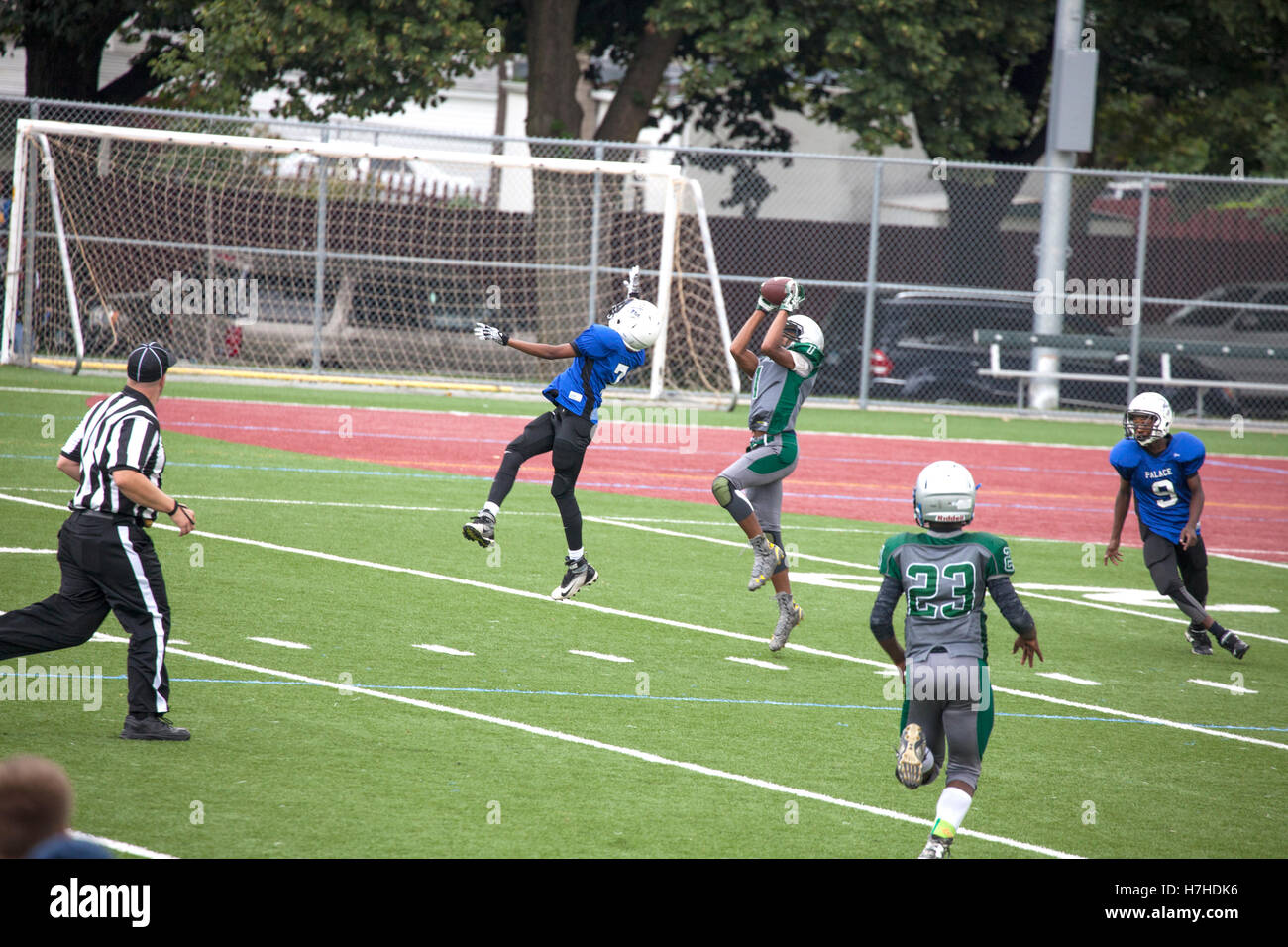 American football player catching ball hires stock photography and