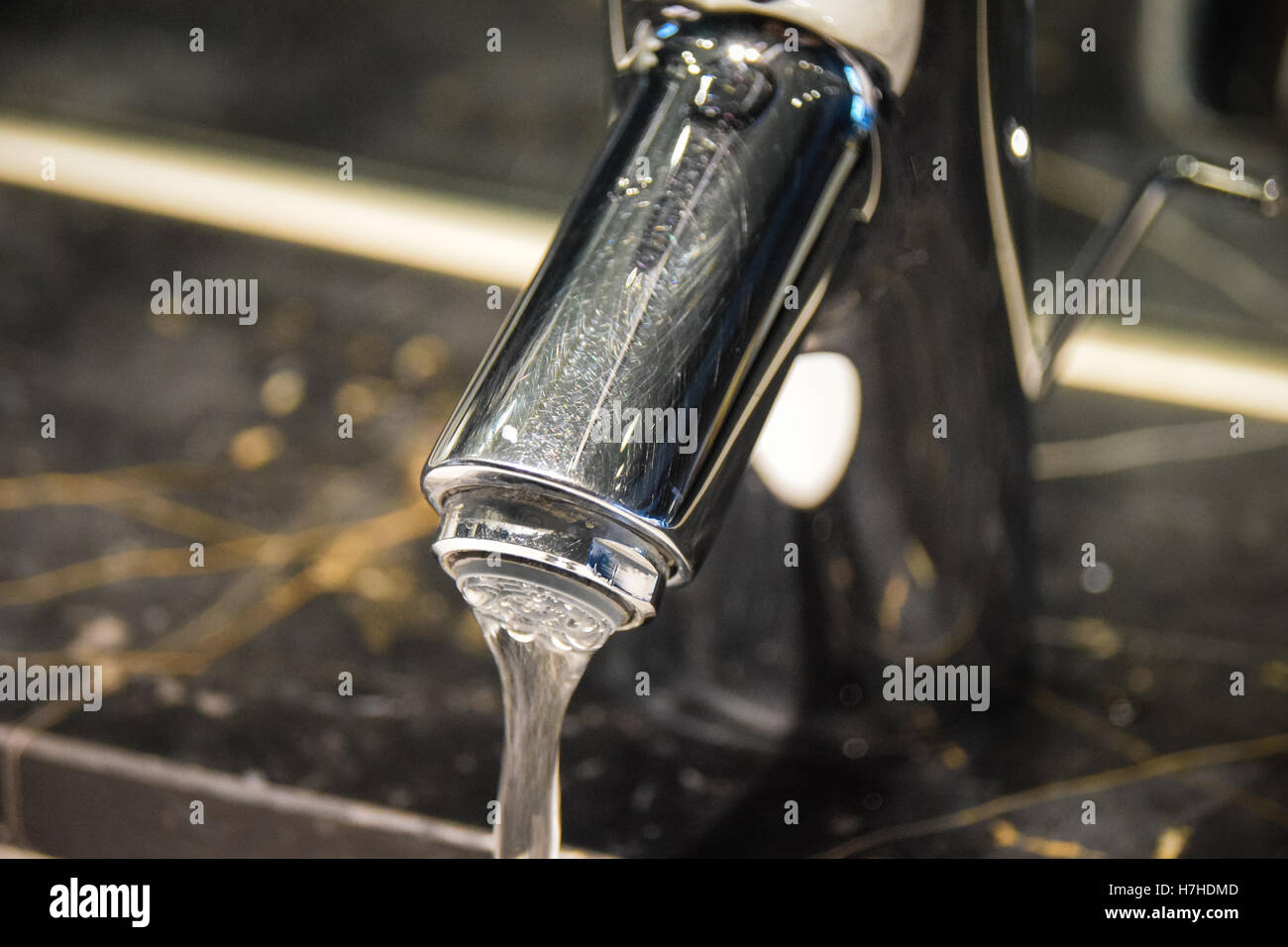 Water running from a tap Stock Photo
