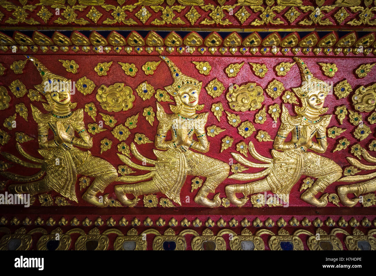 Detailed painted artwork in the buddhist temple, Wat Suan Dok in Chiang Mai, northern Thailand. Stock Photo