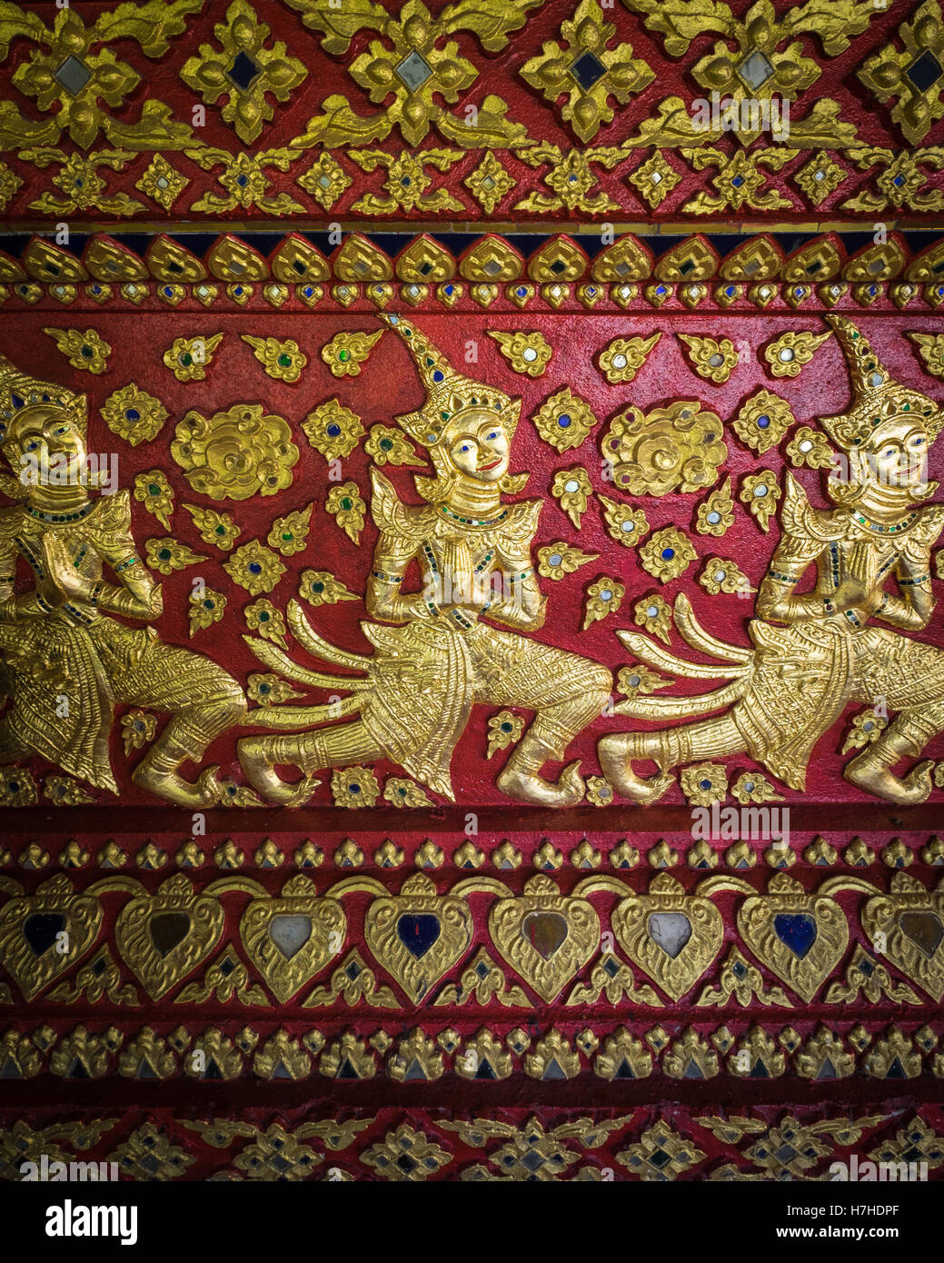 Detailed painted artwork in the buddhist temple, Wat Suan Dok in Chiang Mai, northern Thailand. Stock Photo