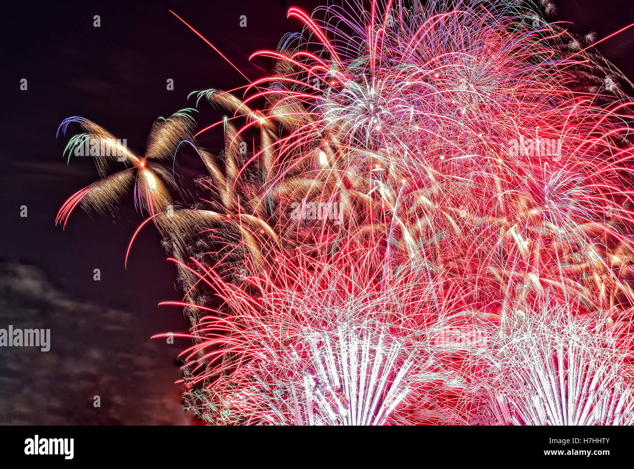 Close view of colorful bouquets of fireworks in the night sky on the night of 31 December to 1 January. close, horizontal view.i Stock Photo