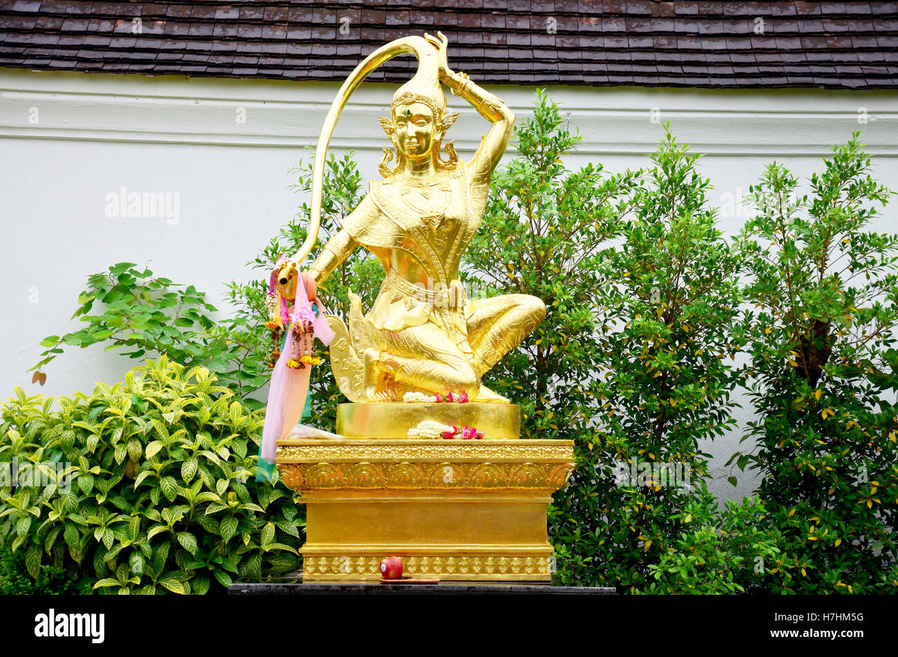 Thai angel statue name Phra Mae Thorani is an chthonic goddess from Buddhist mythology in Southeast Asia at Wat Phra That Chae H Stock Photo