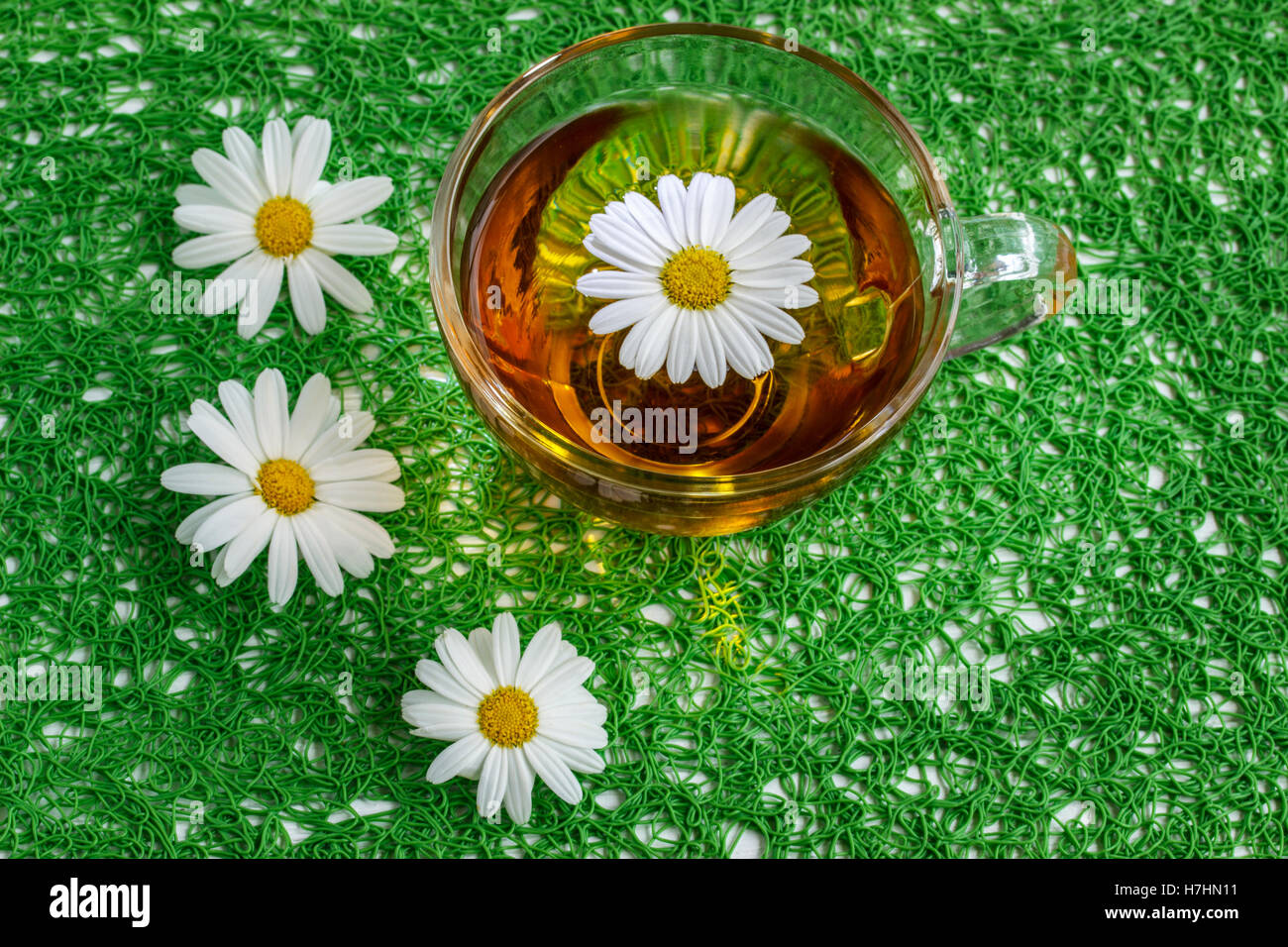 cup of chamomile tea with chamomile flowers Stock Photo Alamy