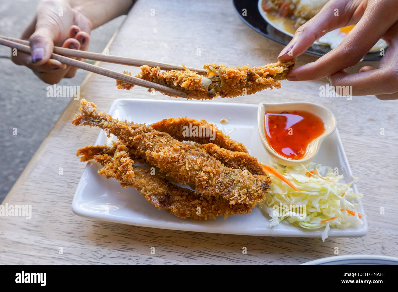 Fish fritter fried with spicy sauce . Stock Photo