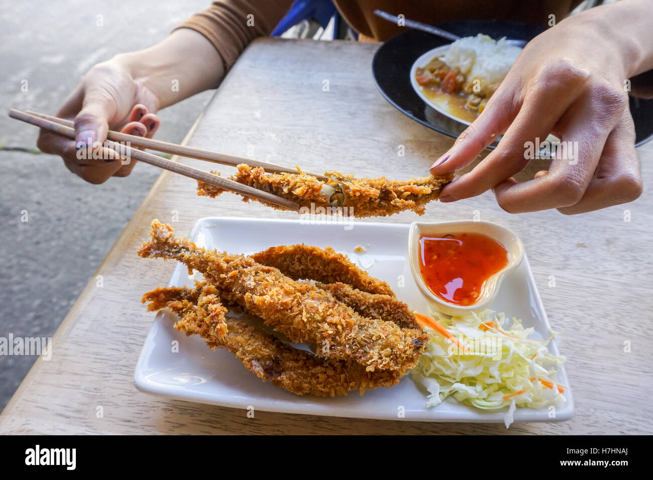 Fish fritter fried with spicy sauce . Stock Photo