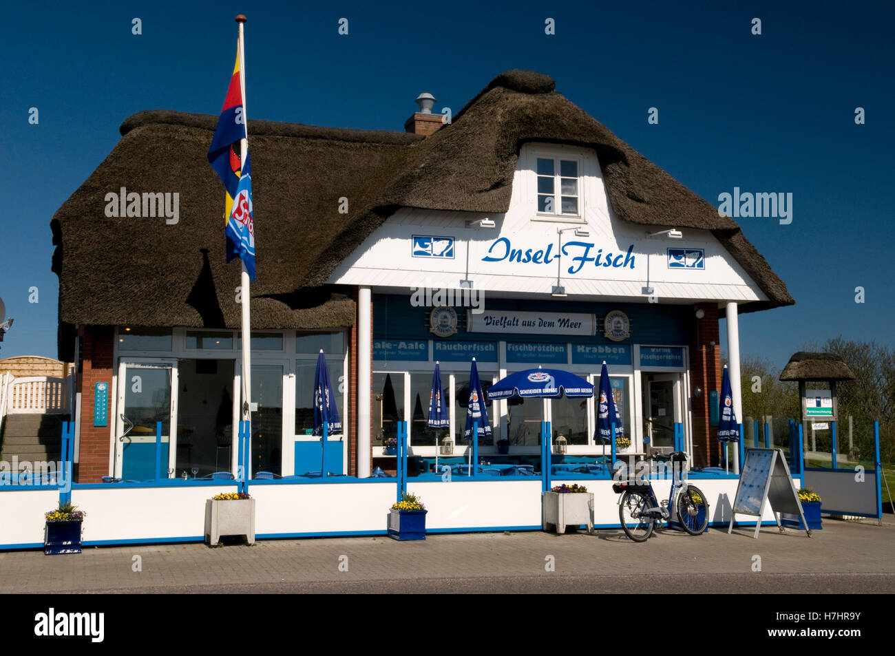 Thatched house, Insel-Fisch restaurant, Norderhafen harbor, Nordstrand island, Schleswig-Holstein Stock Photo