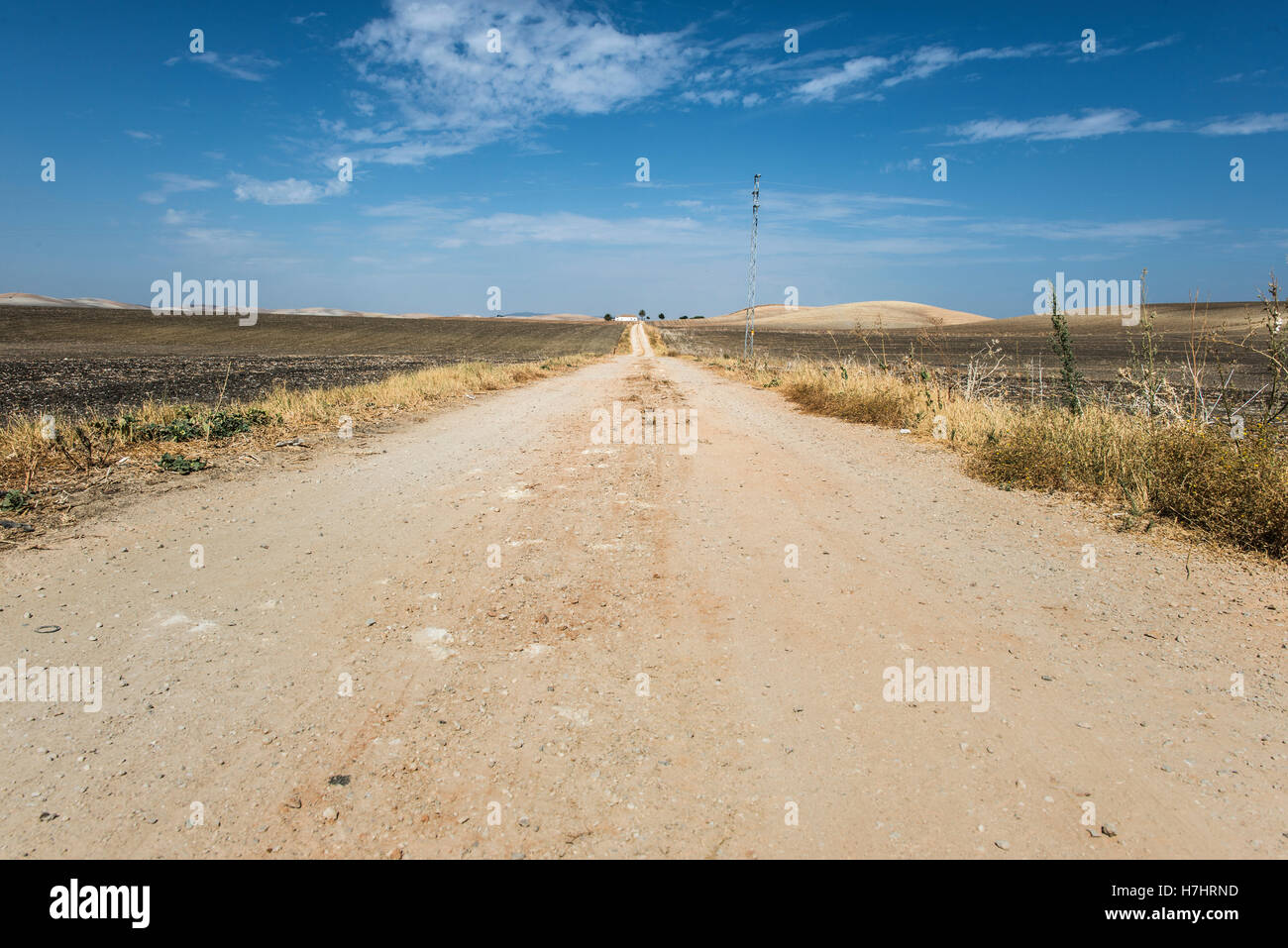 Vintage dirt road and blue sky Stock Photo - Alamy