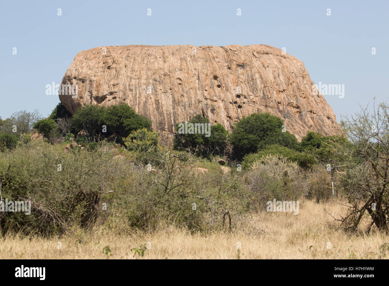 Dramatic rock outcrop dryland savannah landscape Laikipia Plateau near Nanyuki Kenya Stock Photo