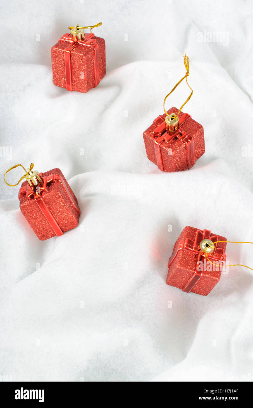 Christmas Baubles on snow white background Stock Photo