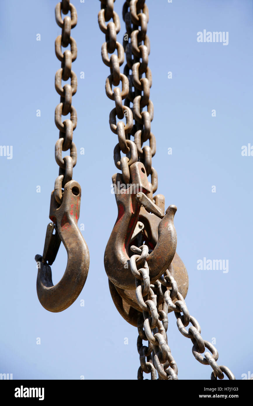 Chains with crane hook as industrial background Stock Photo Alamy