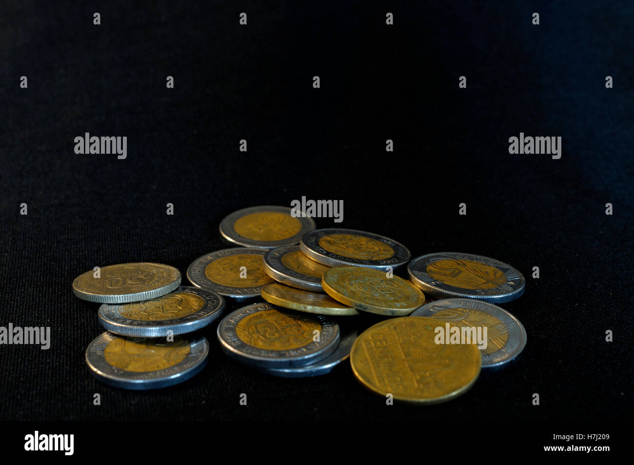 Group of foreign coins in studio photograph. Stock Photo