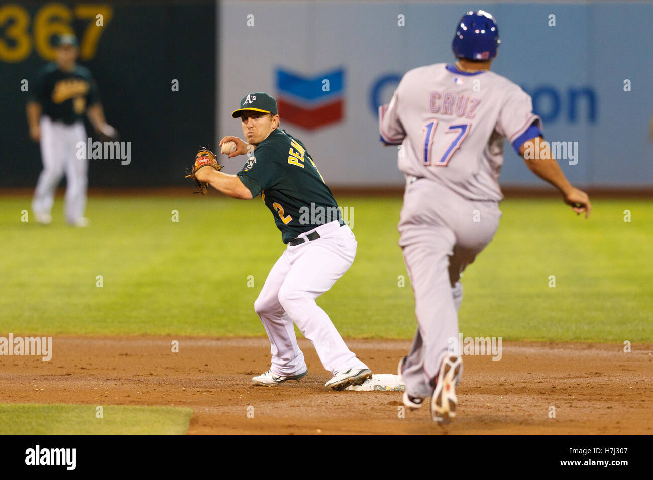 Texas Rangers right fielder Nelson Cruz (L) and relief pitcher