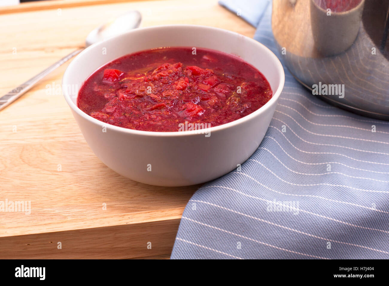 Bowl of homemade borscht on table. Stock Photo