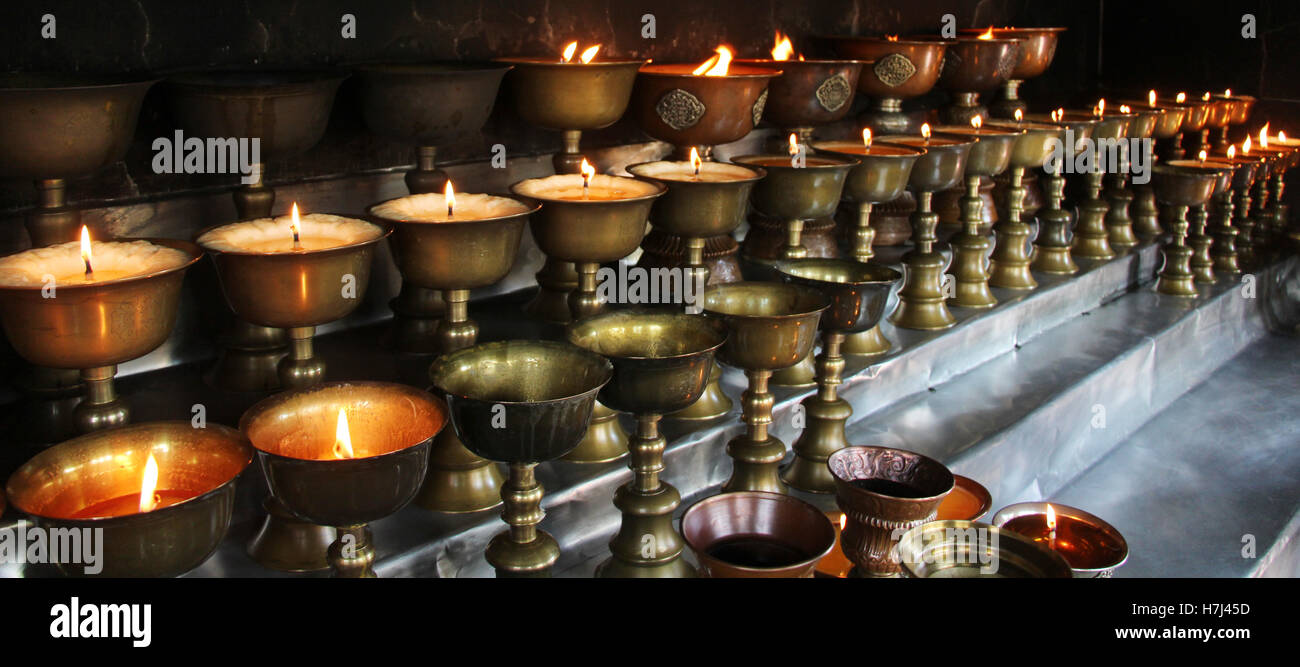 Citronella bucket candle. Charity. Praying candles in a temple Stock ...