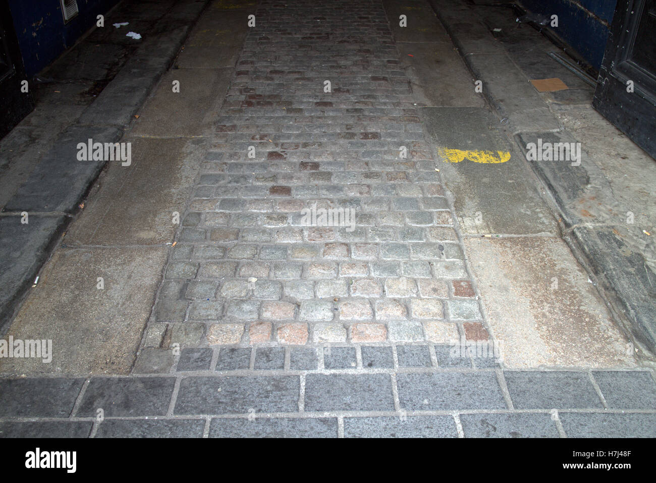 Tram lines and cobbles street pavement Stock Photo