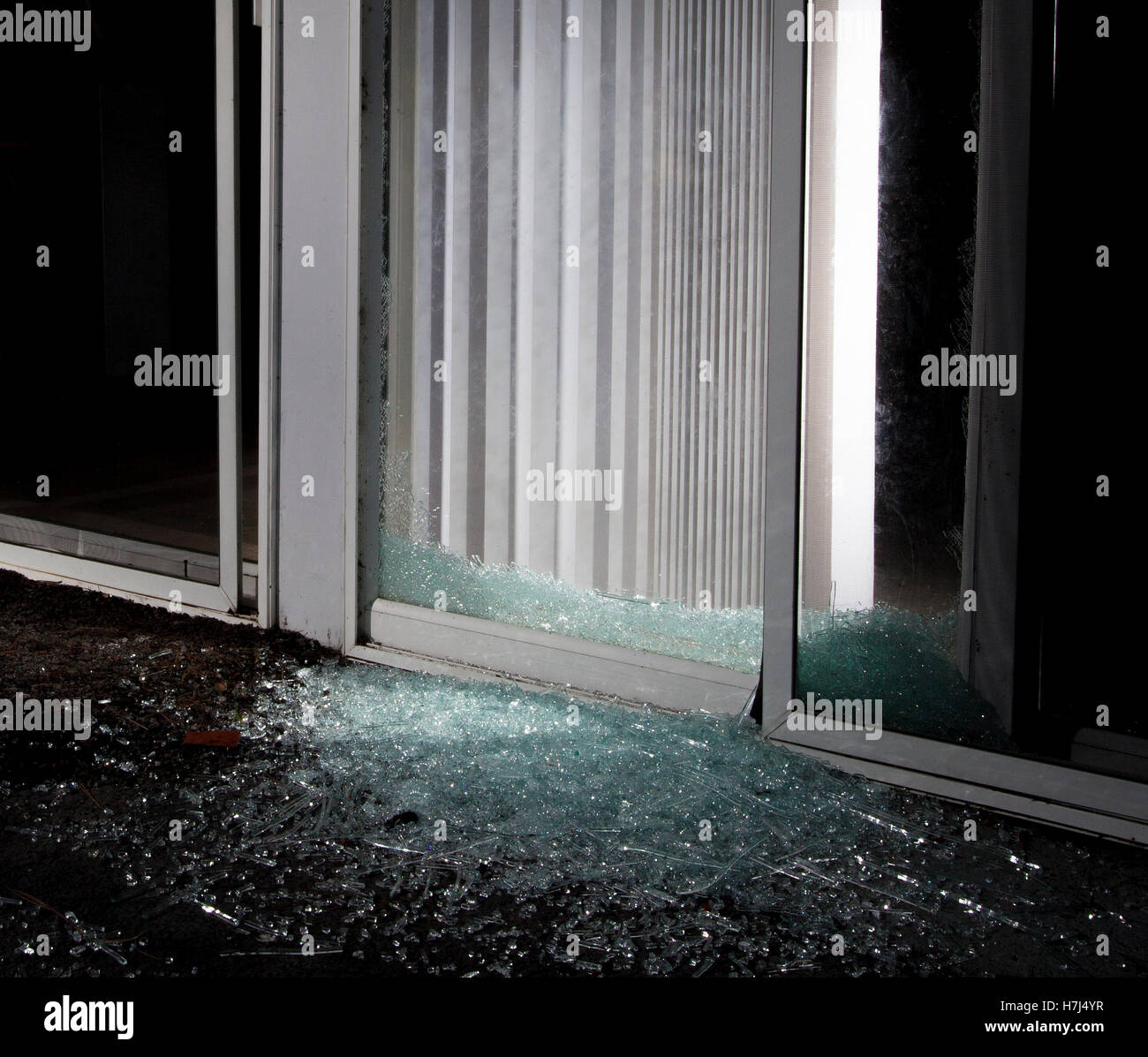 Shattered sliding glass door at night after a break in Stock Photo Alamy