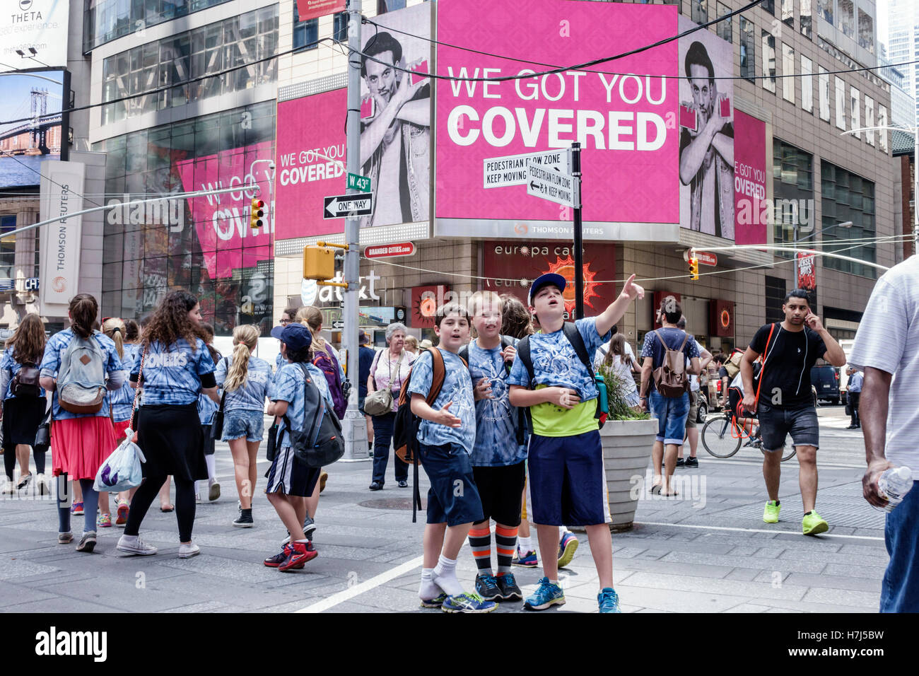 New York City,NY NYC,Manhattan,Midtown,Broadway,Times Square,plaza,crowd,billboards,male boy