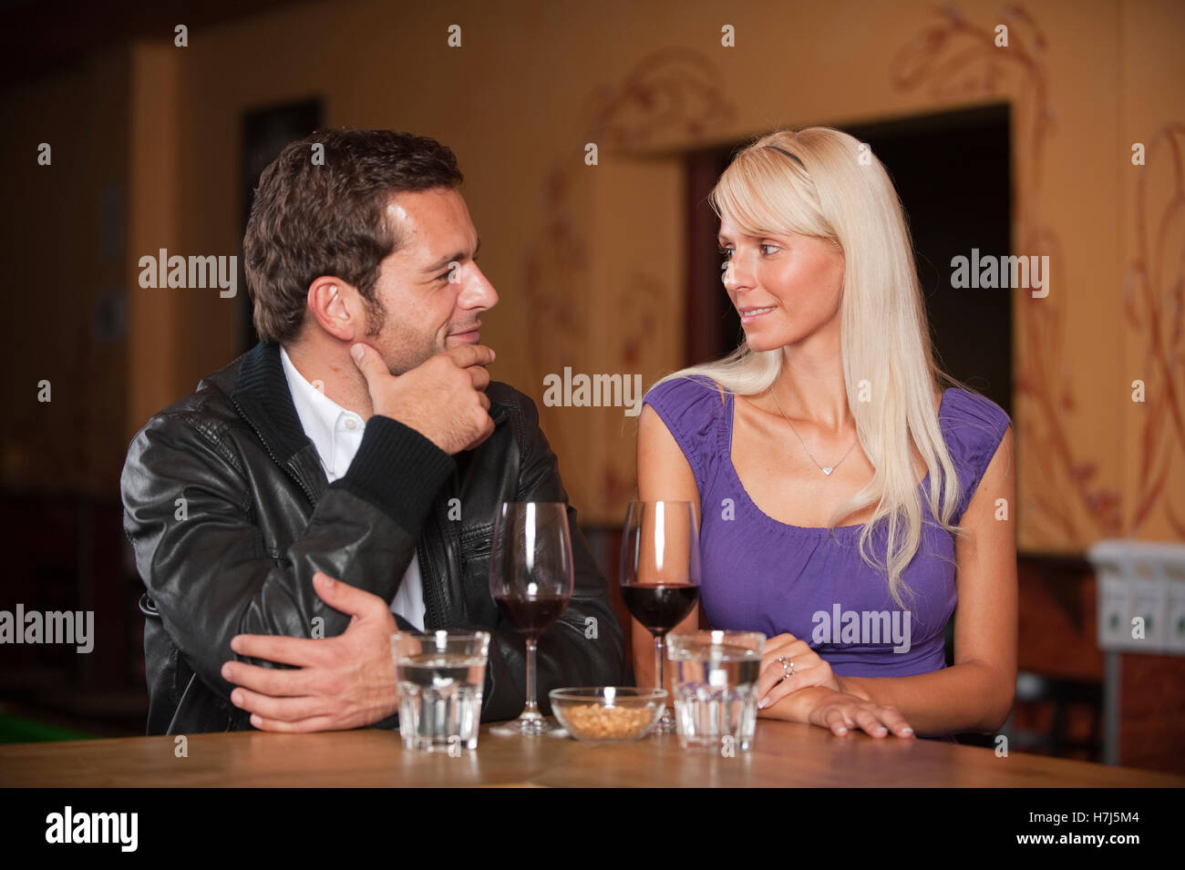 Man and woman sitting at the bar Stock Photo Alamy