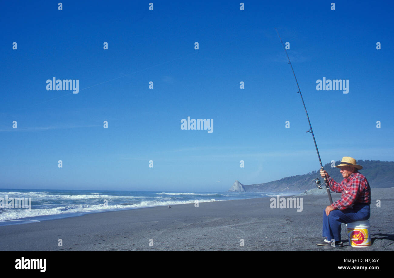 Fisherman, elderly man, on the beach of Humbolt Lagoons, California