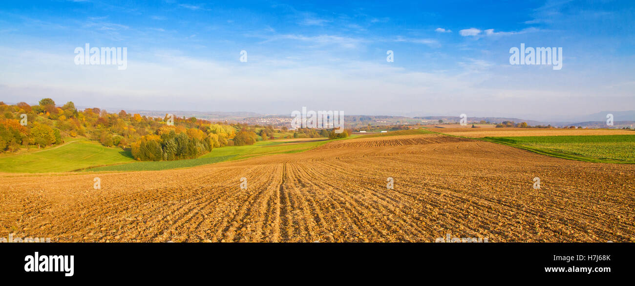 Landscape with fields and colorful trees in autumn Stock Photo - Alamy