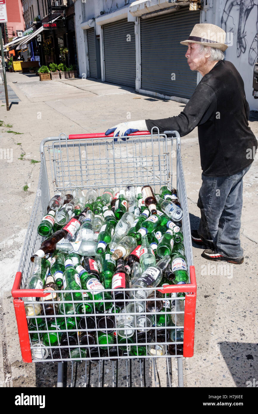 New York City,NY NYC Lower Manhattan,Chinatown,Asian adult,adults,man men male,senior seniors citizen citizens,recycling,shopping car,bottles,glass,co Stock Photo