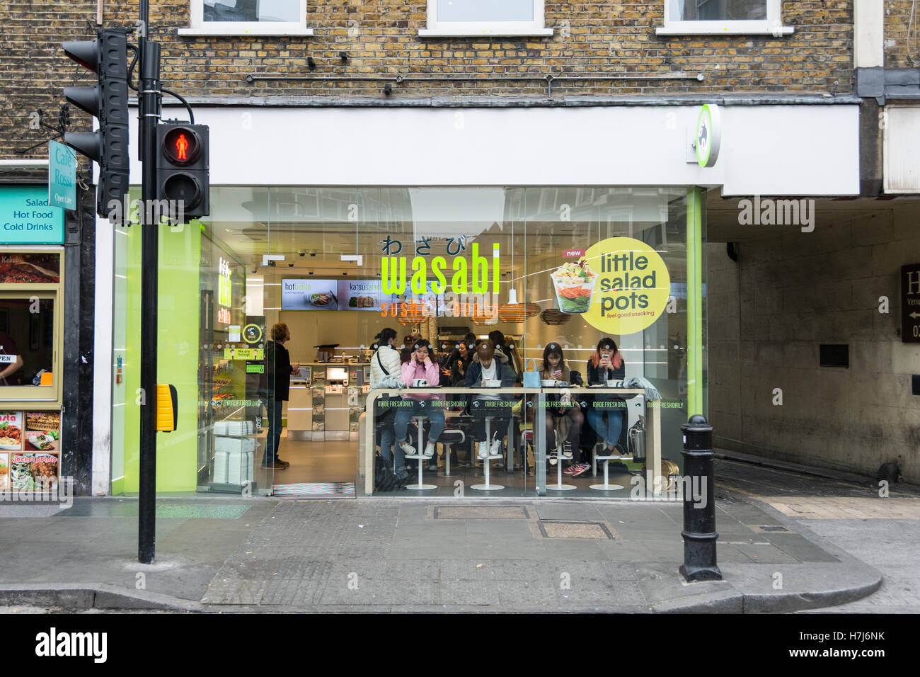 Customers in a Wasabi restaurant seen through the window on Borough