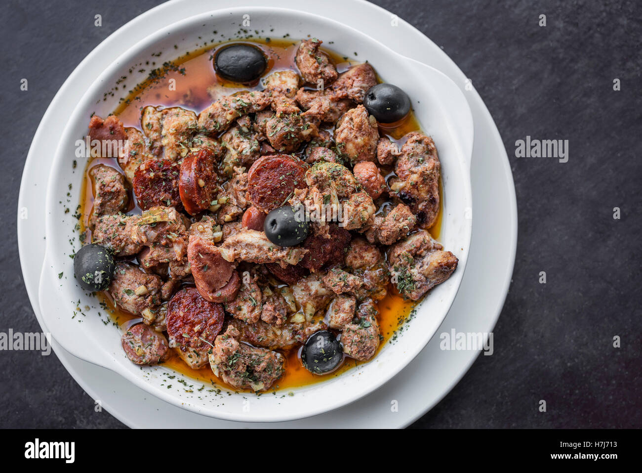 pica pau traditional portuguese spicy sauce pork and sausage tapas snack Stock Photo