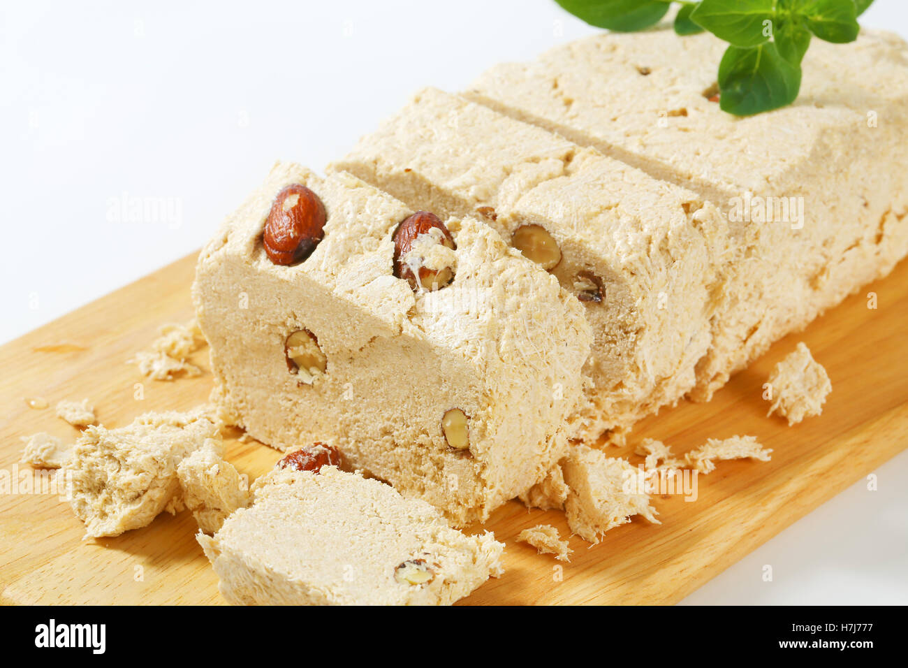 Pieces of Greek halva with almonds Stock Photo