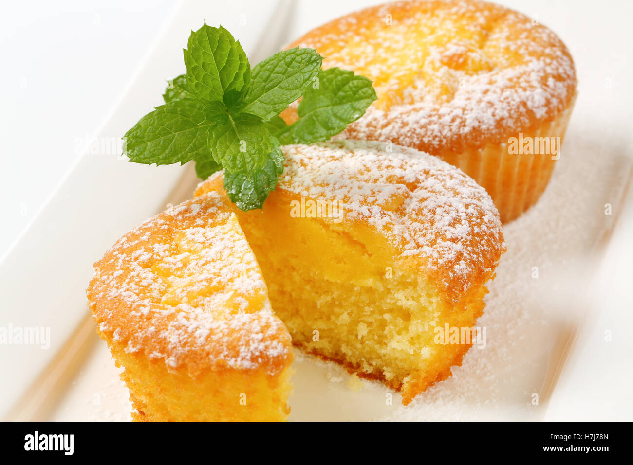 Lemon cupcakes filled with custard Stock Photo Alamy