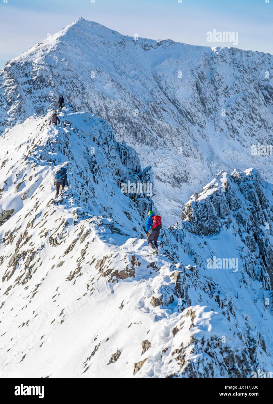 Climbers on Crib Goch, Snowdon,Wales in winter conditions Stock Photo